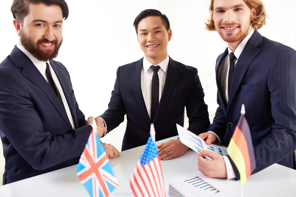 Business executives finalizing international partnership agreement successfully