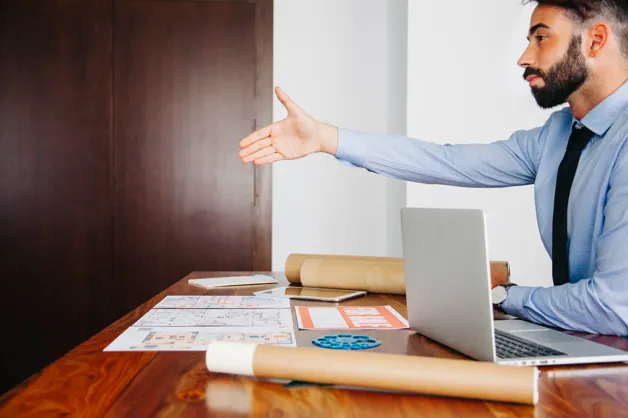 Businesswoman working on laptop at desk